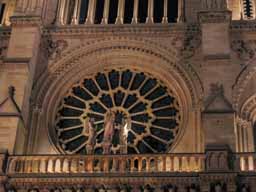 Rose window of Notre Dame de Paris, seen from the outside at night. © 2005 Lykara I. Charters