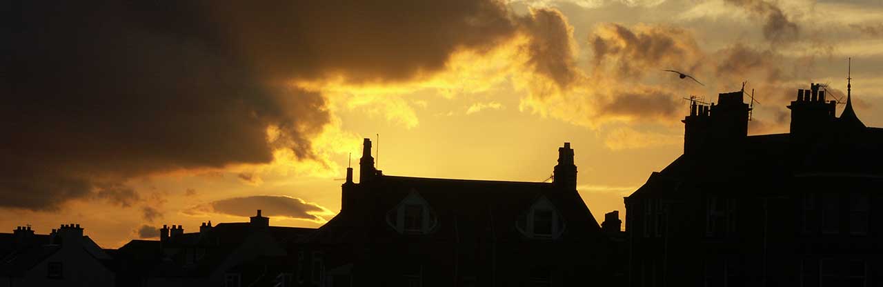 Roofs of Dundee, Scotland, at sunset.